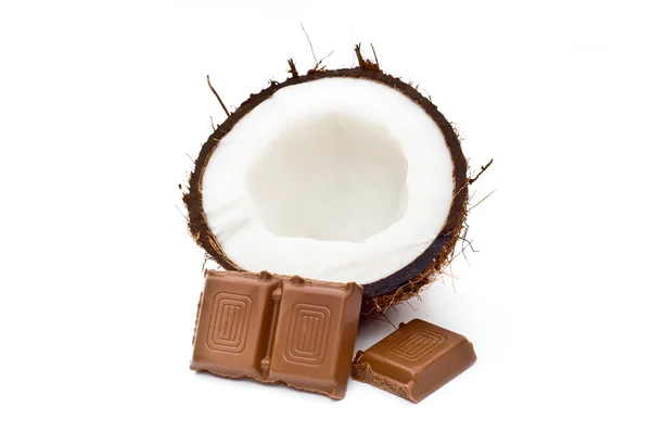 Halved coconut with chocolate blocks — Stock Photo, Image