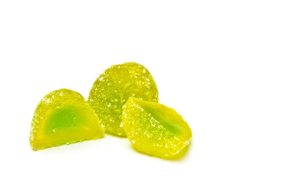 Two green jelly candies halved — Stock Photo, Image