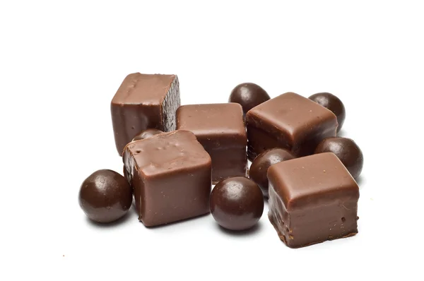 Chocolate cubes and balls fanned out — Stock Photo, Image