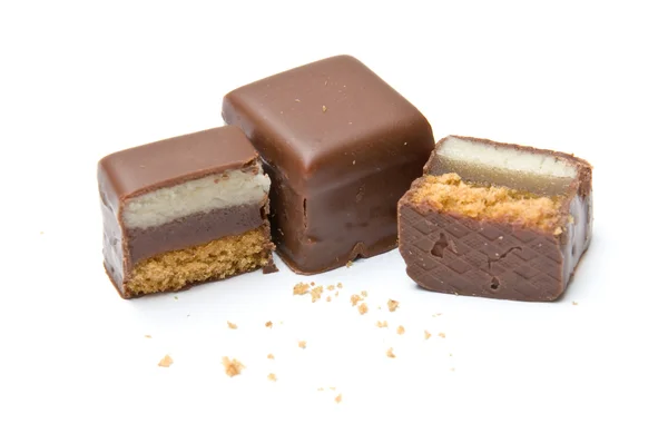 stock image Two and a half filled chocolate cubes with crumbs