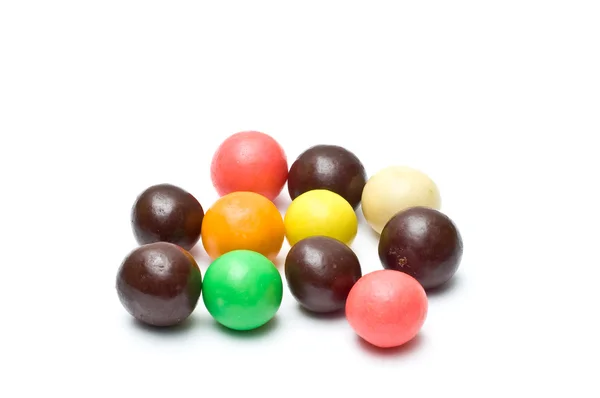 Colorful chewing gums and chocolate balls fanned out Stock Photo