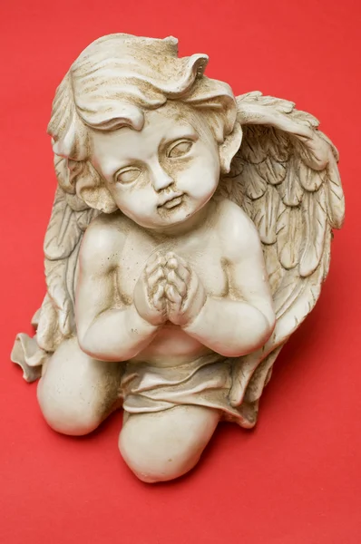 Praying angel looking towards viewer Zdjęcia Stockowe bez tantiem