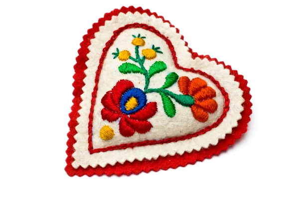 Heart shaped needle pillow decorated with Hungarian embrodiery — Stock Photo, Image