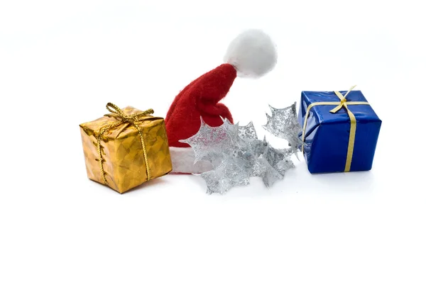 Santa hat and gifts — Stock Photo, Image