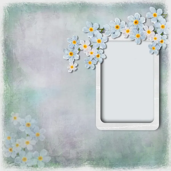 Гранжевий фон з рамкою і квітами — стокове фото