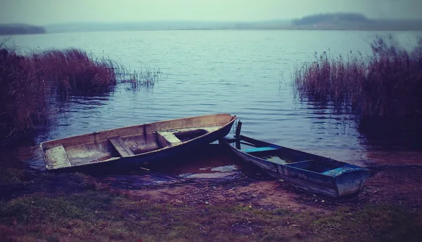 stock image An old boats on the lake