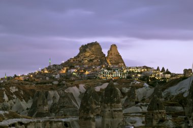 Volcanic landscape and a village in Cappadocia clipart