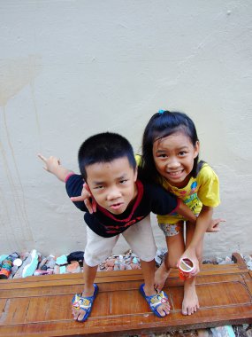 Bangkok May 2010.Children who live along the side rails, Bangkok Thailand clipart