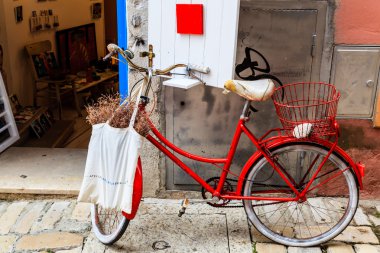 Old Red Bicycle at the Shop Door in Rovinj, Croatia clipart