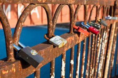 Row of Love Locks on the Rusty Bridge across Volga River clipart