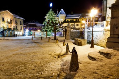 Illuminated Christmas Tree on Central Square of Megeve in French clipart