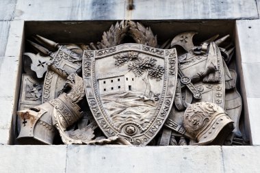 Shield, Helmets and Sword Marble Relief in Genoa, Italy clipart