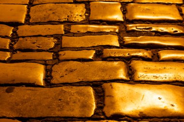 Illuminated Golden Cobblestones of Rovinj, Croatia clipart