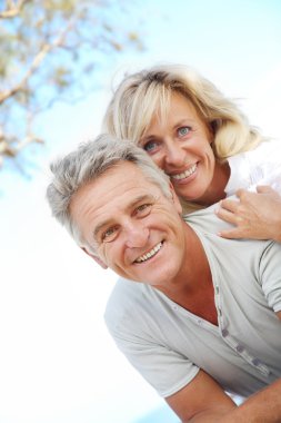 Happy mature couple outdoors. clipart