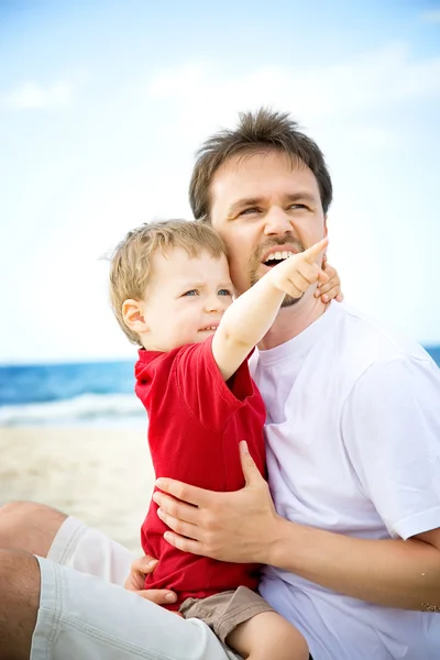 stock image Father and son on the beach