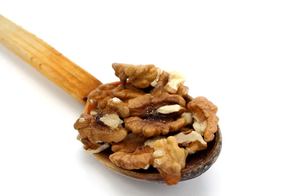 Wooden spoon with walnuts — Stock Photo, Image