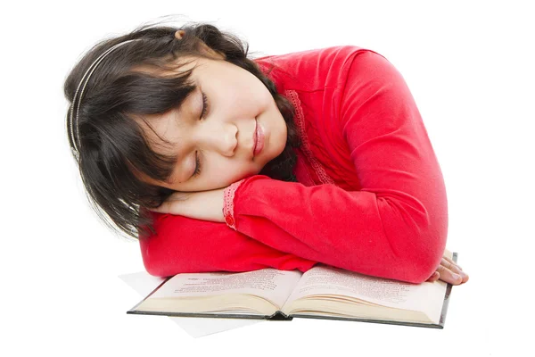 Mädchen schläft auf einem Buch — Stockfoto