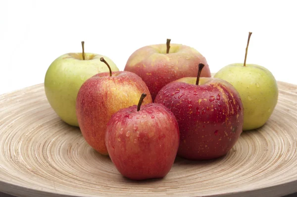 stock image Isolated apples on bamboo dish