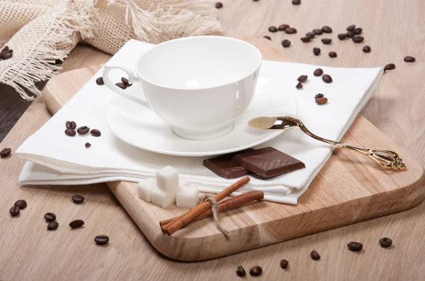 Empty cup with sugar chocolate and cinnamon — Stock Photo, Image