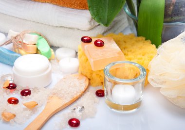 Hand-made soap with towels in a bathroom clipart