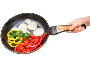 Fried vegetables on a ceramic pan clipart