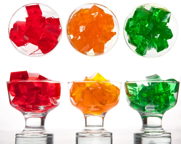 Fresh colorful jelly in glass plate with fruit — Stock Photo, Image