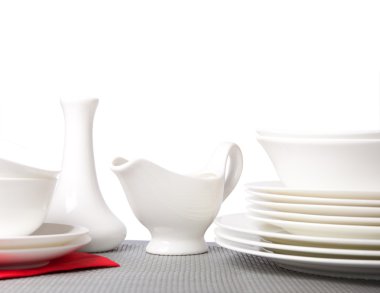 White porcelain plates and saucers clipart