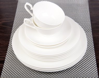 White porcelain plates and saucers clipart