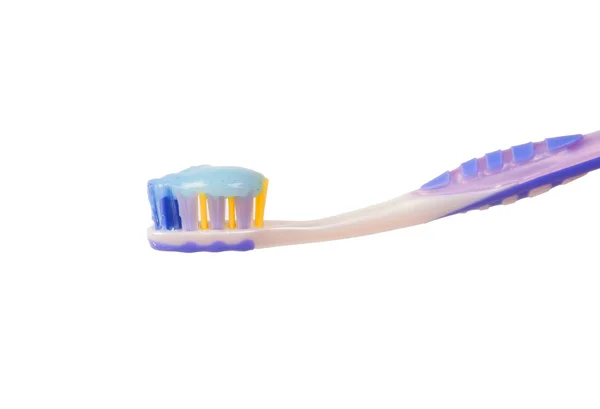 Uma escova de dentes com pasta de dentes — Fotografia de Stock