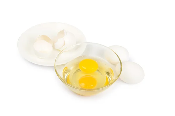 Three white eggs in a glass plate — Stock Photo, Image