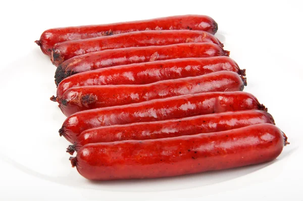 Roasted sausages on porcelain plate — Stock Photo, Image