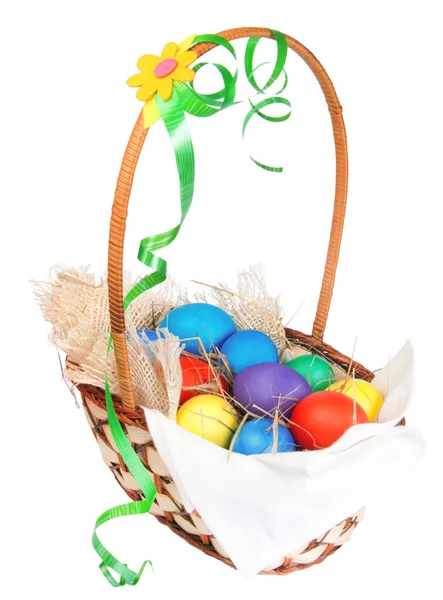 Easter eggs in basket with bow isolated on white — Stock Photo, Image
