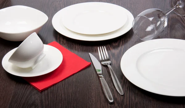 Porcelain plate on a dinner table — Stock Photo, Image