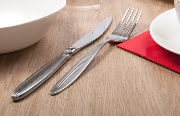 Fork and knife on a table — Stock Photo, Image