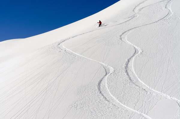 Skier in the deep powder snow