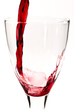 Red wine is flowing into the wine glass V4 clipart