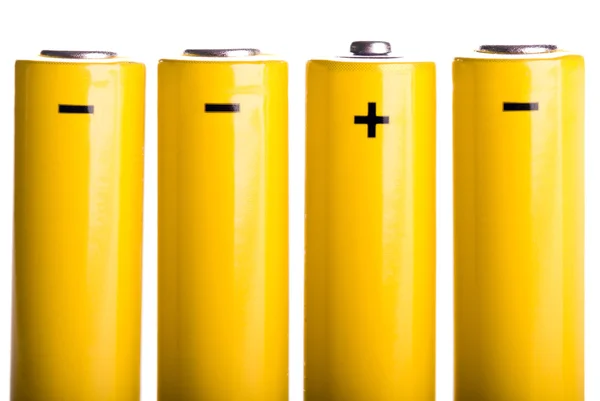 Vier gele batterijen permanent — Stockfoto