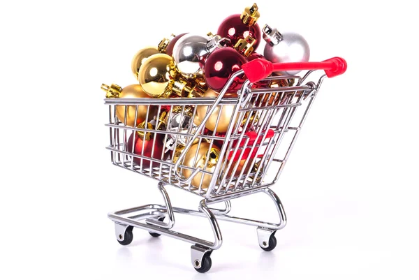 Shopping cart with Christmas balls — Stock Photo, Image