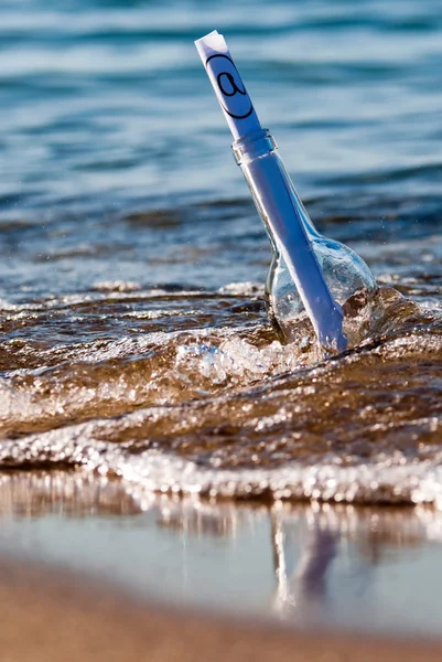 Message in a bottle in the surge — Stock Photo, Image