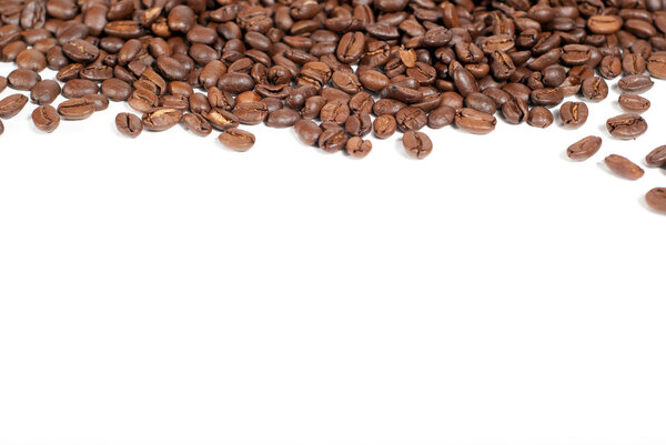 Brown coffee beans with copy space on white background