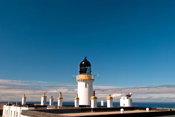 Lighthouse against a blue sky V1 — Stock Photo, Image
