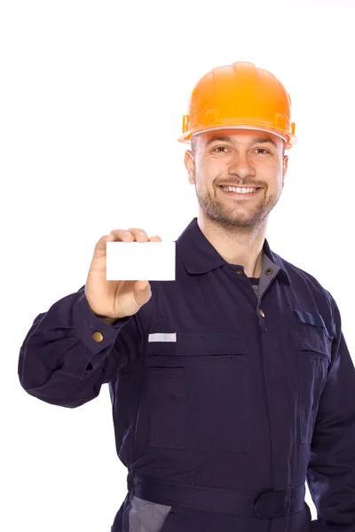 Porträtt av byggare med visitkort på en vit bakgrund — Stockfoto