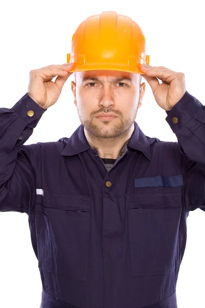 Portrait of the builder with visiting card on a white background — Stock Photo, Image