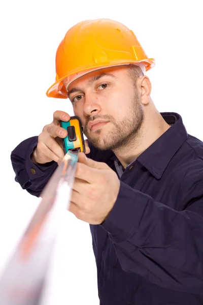 Rasgo de un joven constructor con las herramientas — Foto de Stock