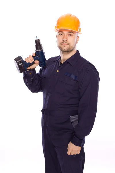 Portret van een bouwer met een boor in zijn handen op een witte achtergrond — Stockfoto