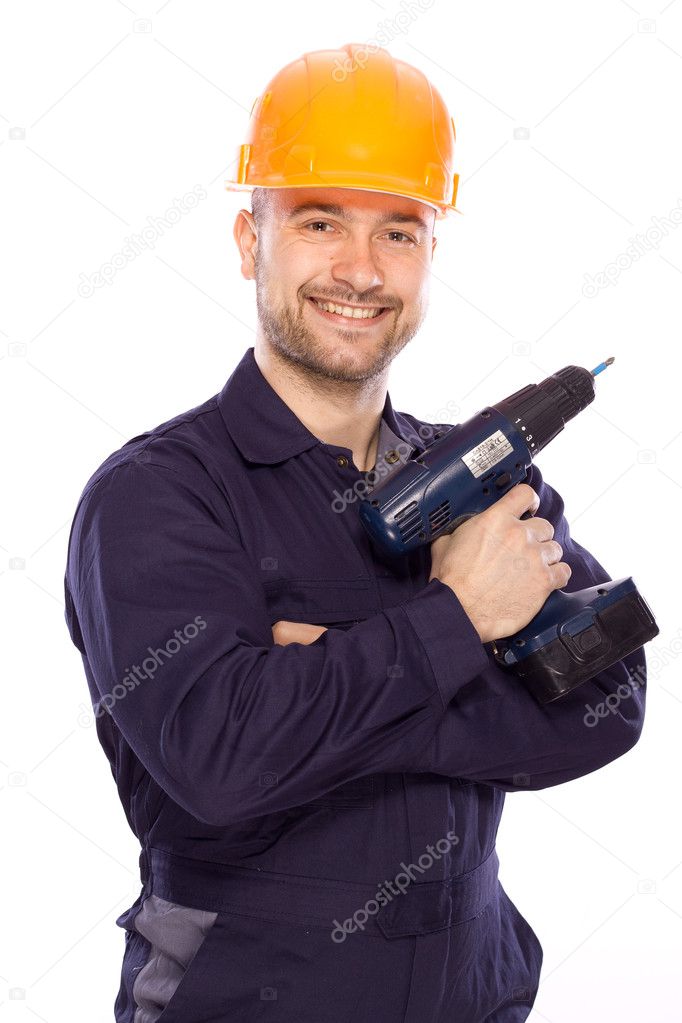 Portrait of a builder with a drill in his hands on a white background