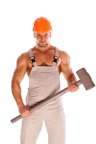 Ung och vacker builder med en slägga och sexig kropp — Stockfoto