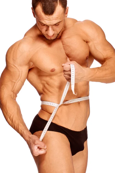 正在测量肌肉和晒黑的男性身体部位 — 图库照片