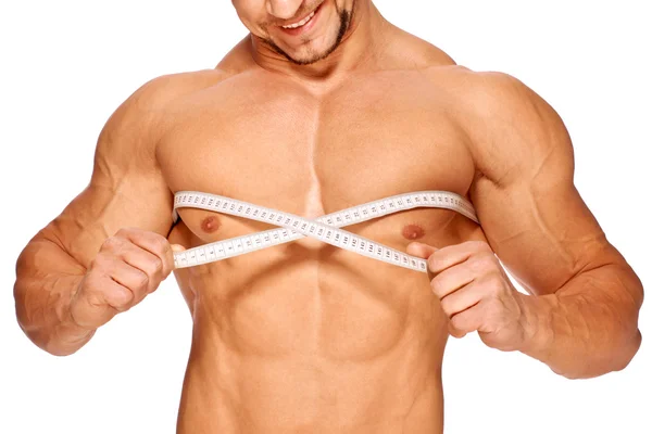 Muskulöse und gebräunte männliche Körperteile werden vermessen — Stockfoto
