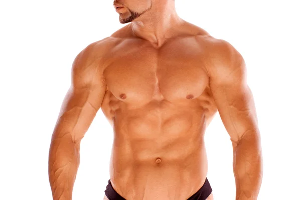 Kaslı erkek vücut geliştirmeci beyaz zemin üzerine — Stok fotoğraf